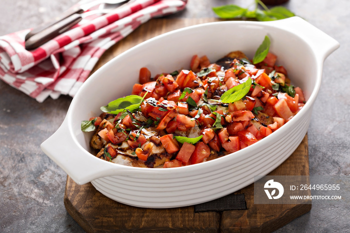 Bruschetta chicken with cheese, fresh tomatoes and basil