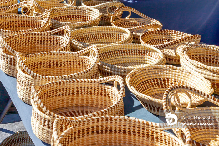 Sweetgrass Baskets,  beautiful handicrafts of African origin, on display at historic Charleston City Market in Charleston, South Carolina.