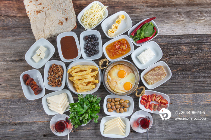 Delicious traditional turkish breakfast.  Breakfast on the grey wooden table, top view.