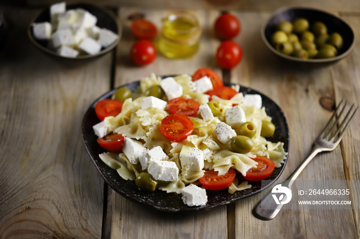 Pasta bows with feta and olives. Italian Cuisine.