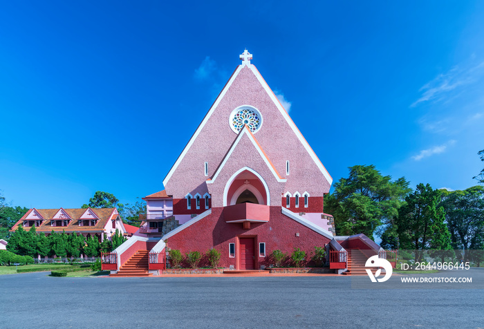 Aerial view outside Domaine De Marie Church on a morning. Old French architecture attracts parishioners to pray for peace at the weekend in Da Lat, Vietnam