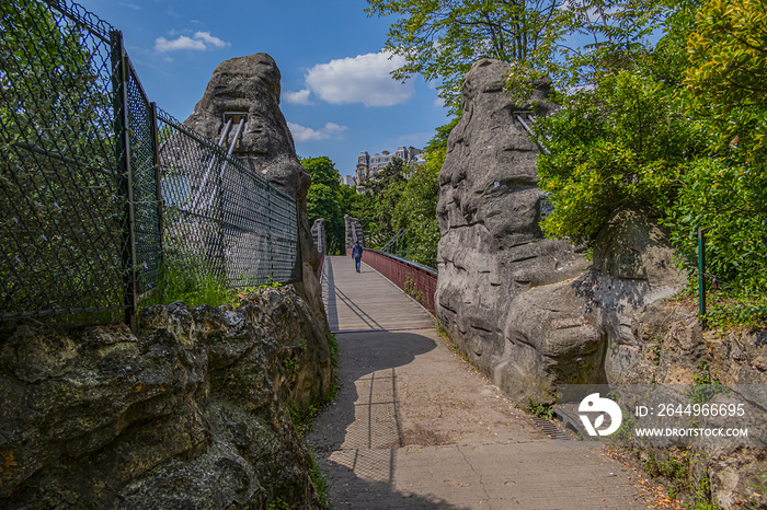 63-meter-long suspension bridge (1867) in Buttes-Chaumont Park (Parc des Buttes-Chaumont, 1867) - Public Park situated in northeastern Paris, fifth-largest park in Paris. Paris. France.