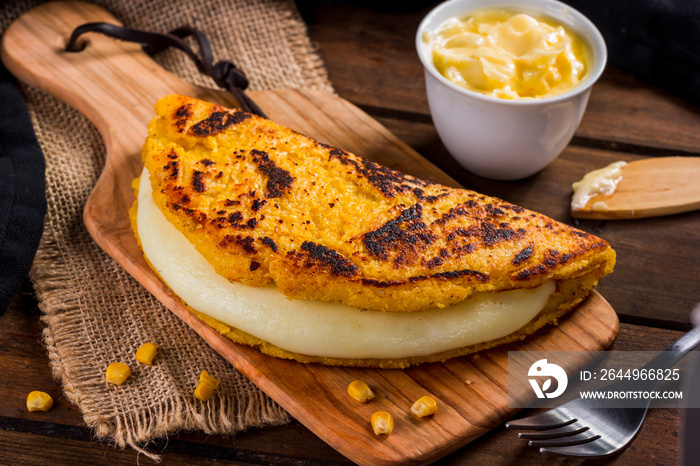 Cachapa with cheese, typical Venezuelan dish made with corn, cheese and butter