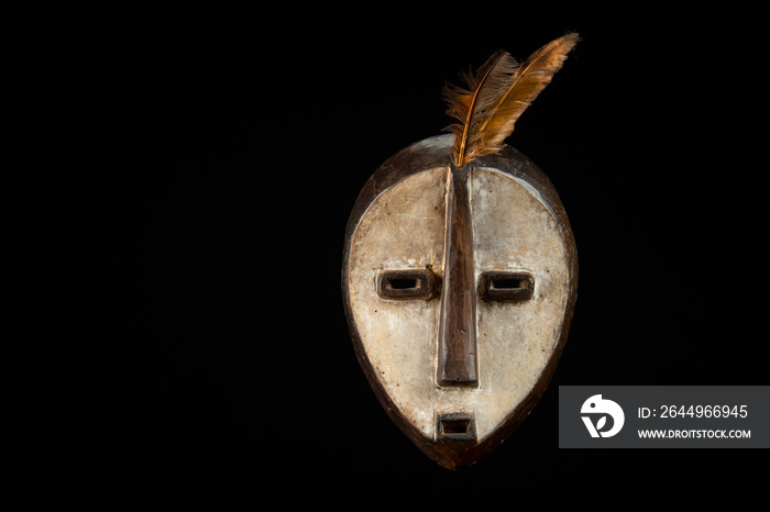 African mask from Gabon on a black background