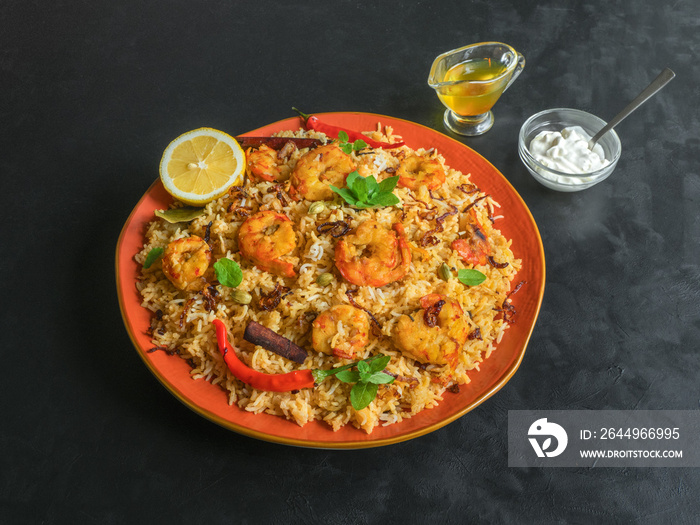 Traditional Indian Biryani with shrimp. Tasty and delicious prawns biryani