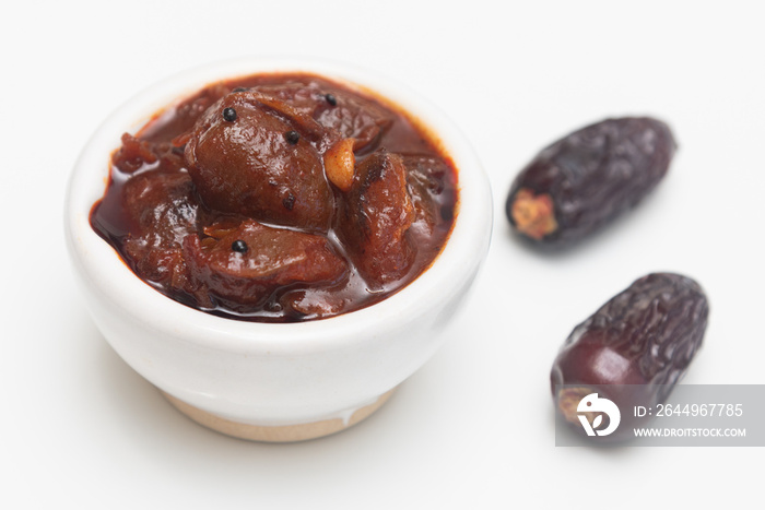 Dates fruit pickle spicy. Dates Tamarind Chutney. Dates crushed to paste with Imli or imalee paste and served as a side dish in Kerala India. Indian pickle.