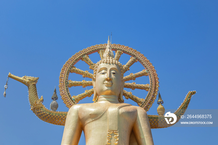 Public big Buddha temple in Wat Phra Yai sitting under blue sky most popular famous landmark tourist destination Koh Samui Surat Thani province, Thailand