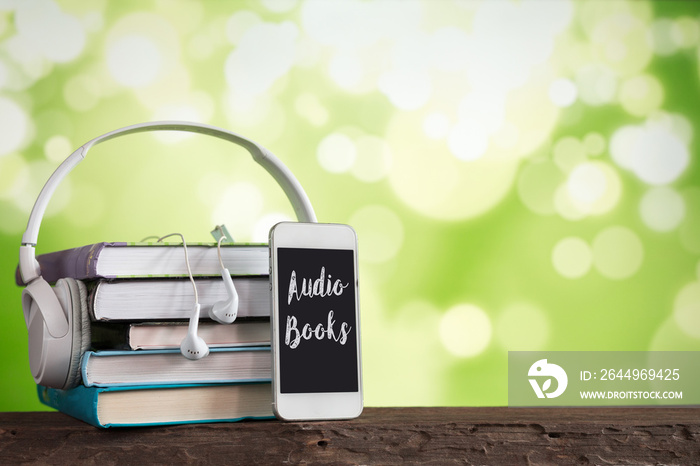 White headphones and books, concept books audiobooks and e-learning,e-book