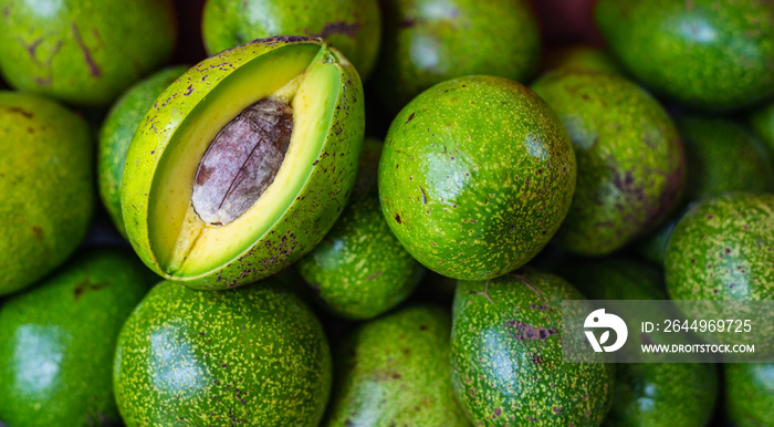 Avocado pile in avocado shop at fruit market.