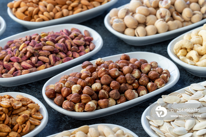 Hazelnut in selective focus. Types of nuts found in bulk on a dark background