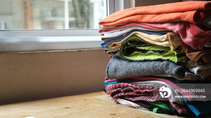 Piles of freshly washed and folded clothes