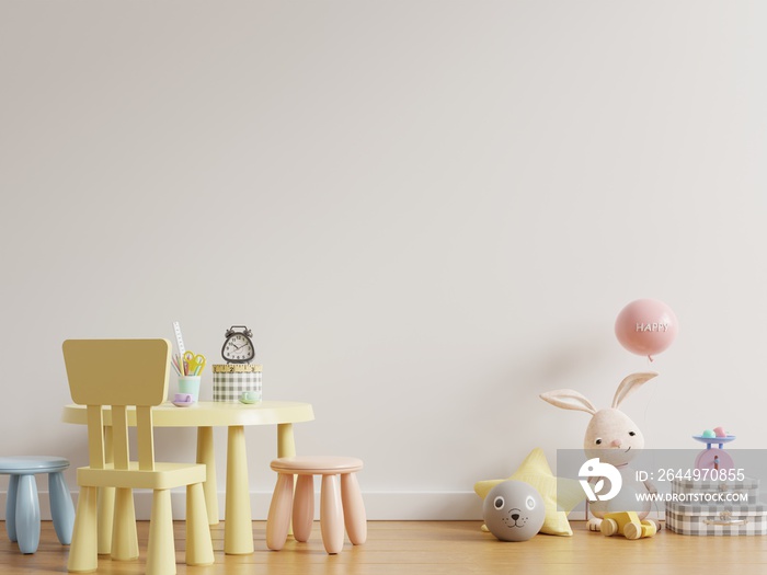 Mock up wall in the children’s room with kid table set in light white color wall background.