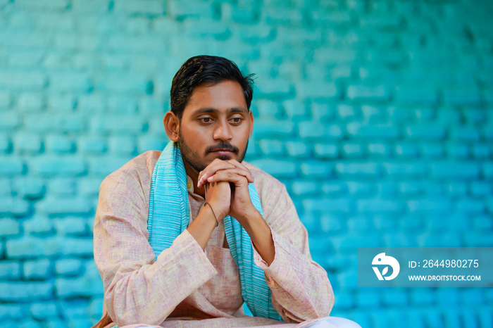 Young indian farmer in depression.