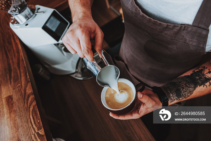 Top view of the process of latte art creation in cafe