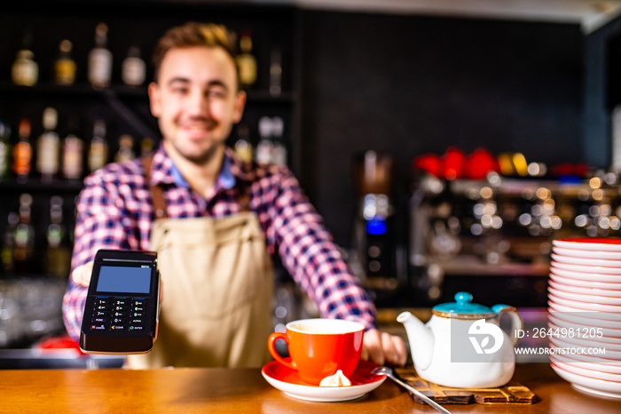 paying by credit card at cafe concept Customer paying for order with a smart phone contactless payment