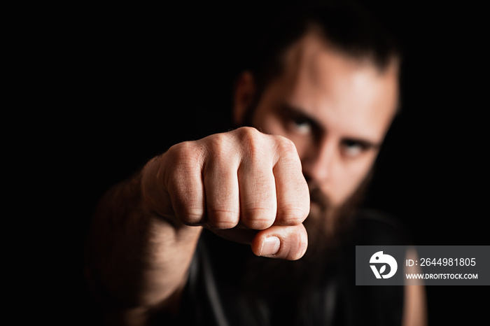 Biker holding a fist up to the camera