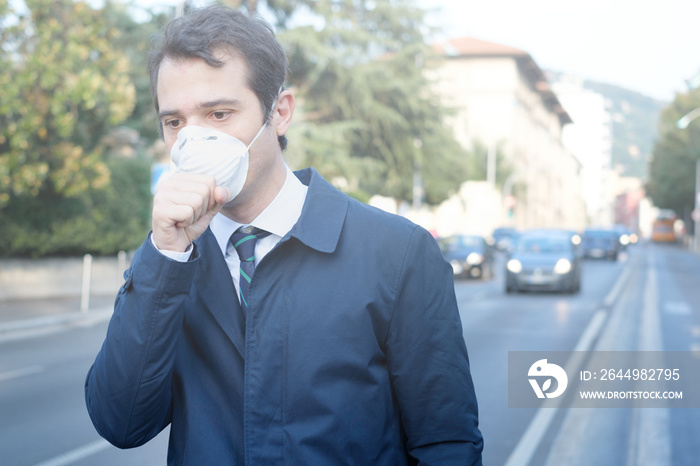 Man wearing mask against smog air pollution