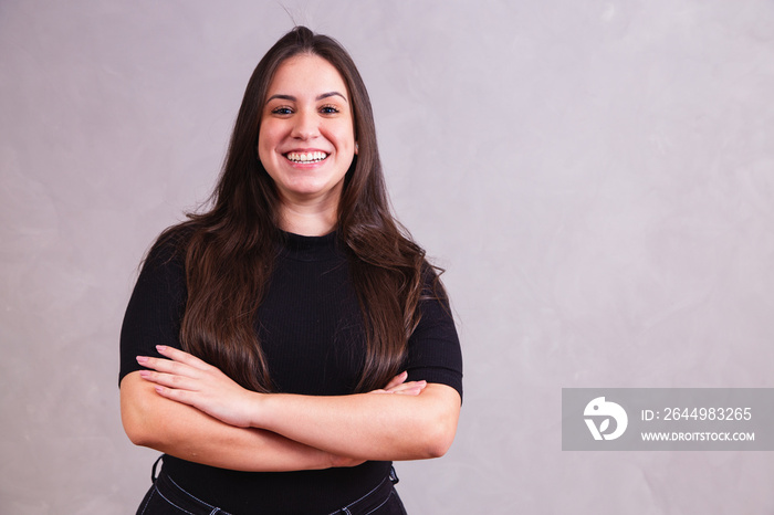 beautiful plus size woman with arms crossed looking at camera