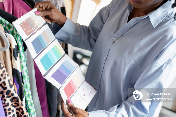 Fashion designer looking at color swatches