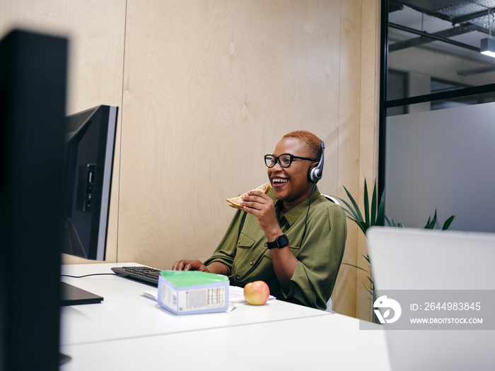 Woman using computer in office