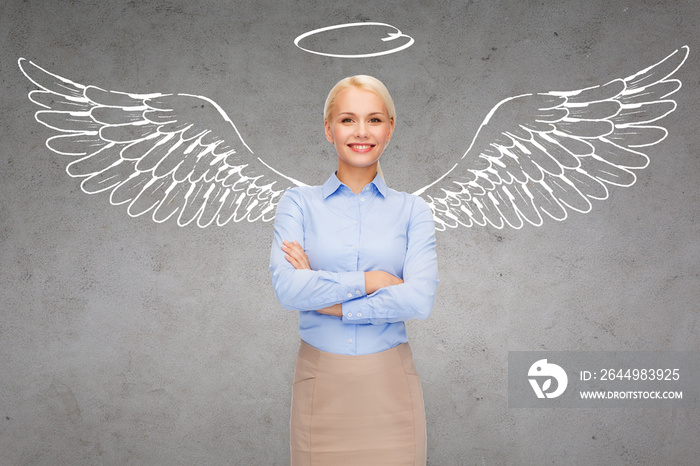 happy businesswoman with angel wings and nimbus