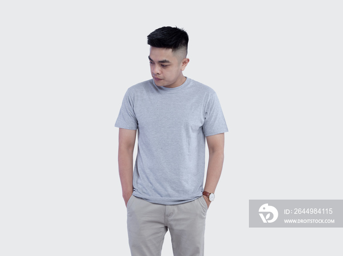 Young handsome man was posing wearing heather grey t-shirt short sleeve with mockup concept