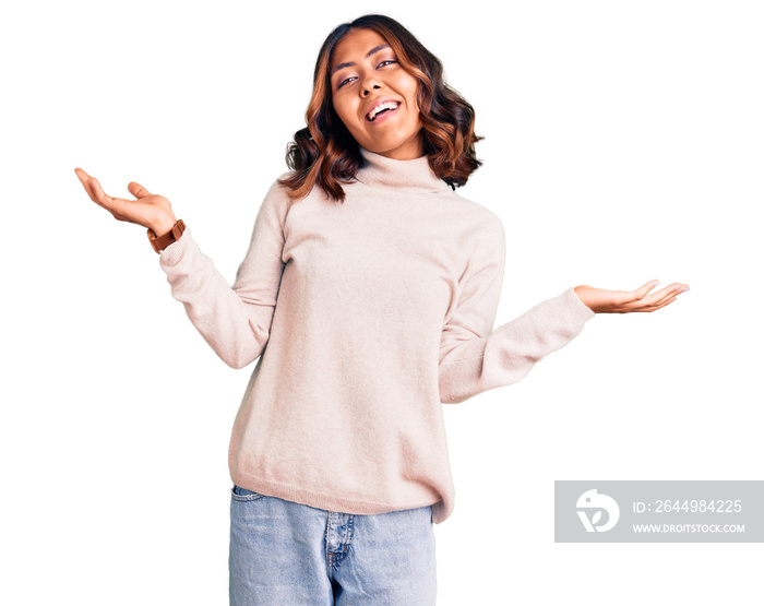 Young beautiful mixed race woman wearing winter turtleneck sweater smiling showing both hands open palms, presenting and advertising comparison and balance