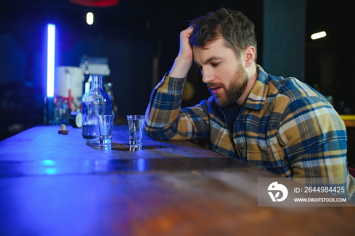 Young drunk man in bar