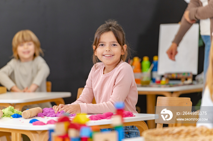 Portrait of preschool children playing. Healthy learning environment.