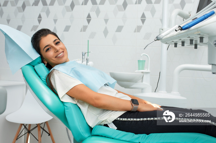 Overview of dental caries prevention.Woman at the dentist’s chair during a dental procedure. Beautiful Woman smile close up. Healthy Smile. Beautiful Female Smile