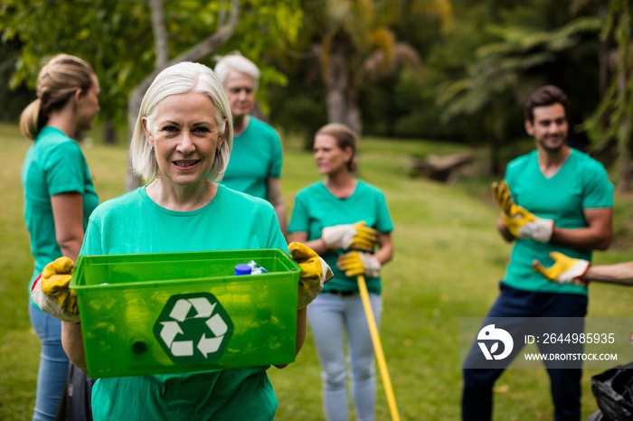 Recycling team member standing in park