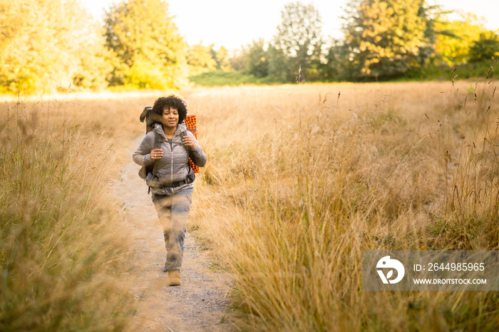 U.S. Army female soldier putting in the miles with an early morning hike in the NorthWest.