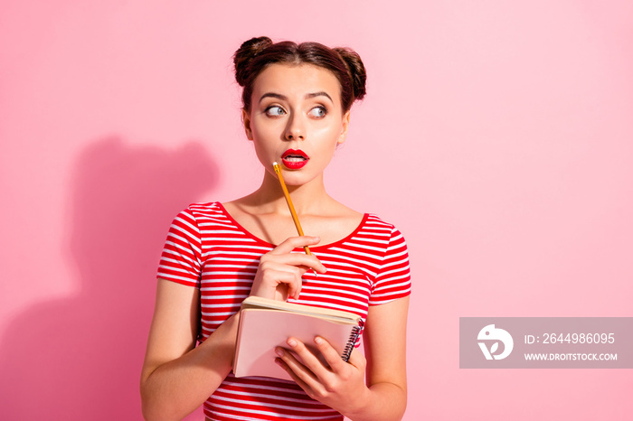 Portrait of her she nice-looking cute attractive winsome curios teen girl wearing striped t-shirt creating letter copybook isolated over pink pastel background