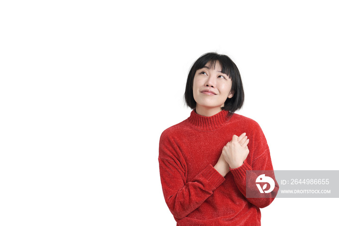 Young asian woman reminiscing about love wearing winter red sweater, isolated.