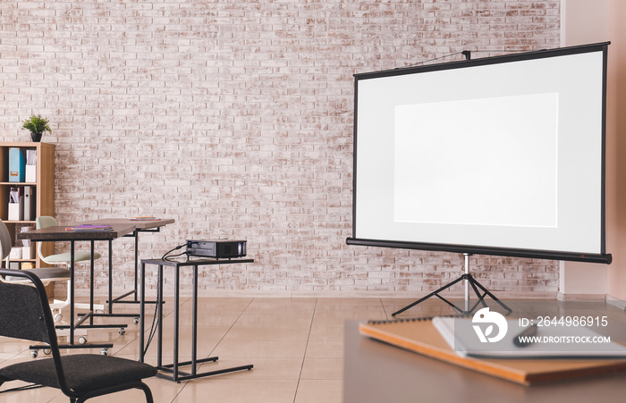 Room with projector prepared for conference in office