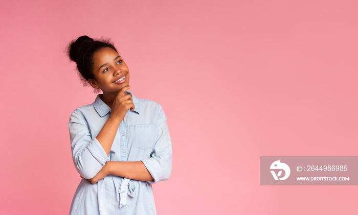 Dreamy Girl Touching Her Chin While Thinking On Studio Background