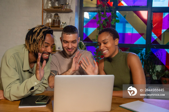 Group of friends having video call on laptop