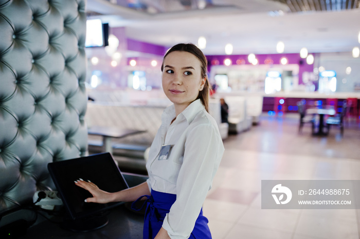 Waiter girl working with pos terminal or cashbox at cafe. People and service concept