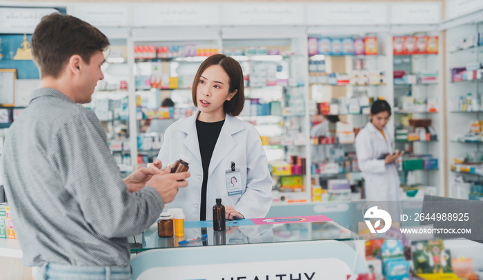 Female pharmacist with medical expertise.Business, pharmacy, professional health care.The doctor prescribes the pills according to the customer  prescription.