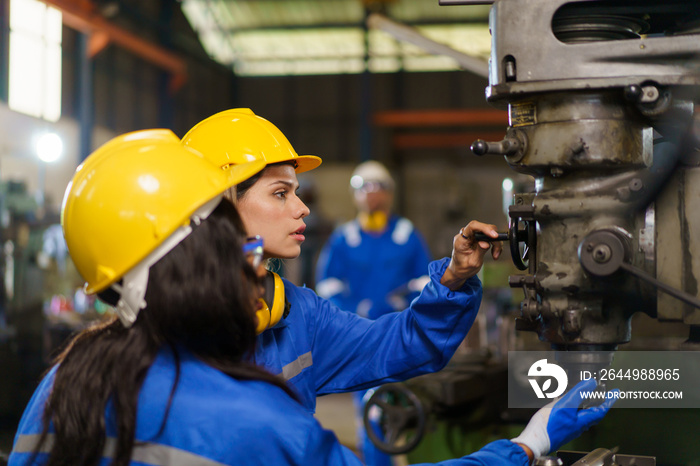 Team of mechanical engineer working together in the factory.