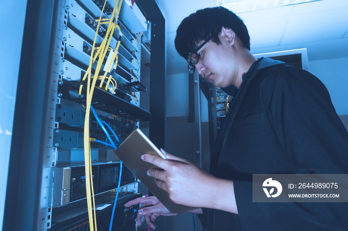 Engineer with toolboxs come to server room for work,check problem of network,repair server in the server room,thailand people,asian man