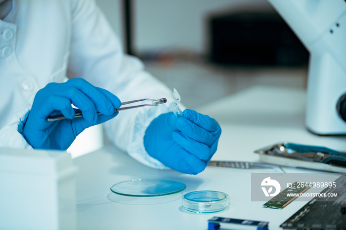 Laboratory Technician Working with Chip Implants