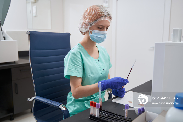 Young woman in uniform working in the hospital