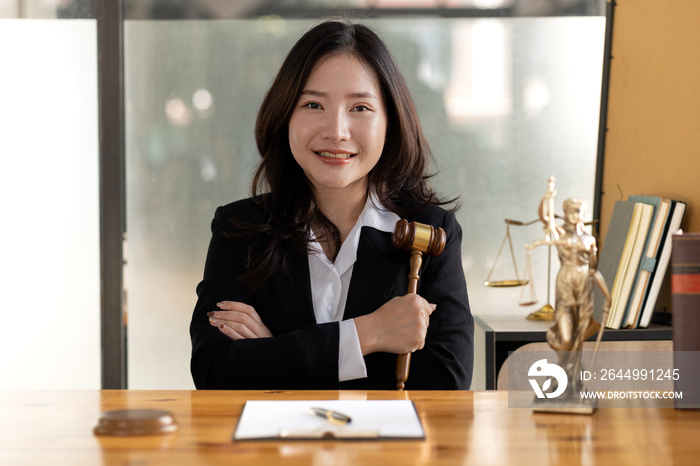 Woman sitting in the office, she’s a good woman lawyer, she’s a lawyer serving clients to fight cases, she’s advising and fighting cases. that has been fully acknowledged. Lawyer concept and justice.