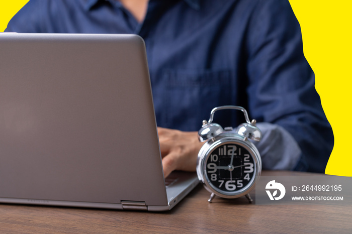 Male employee reading data from computer while working from home or WFH To prevent contact from the Corona virus, Covid-19.