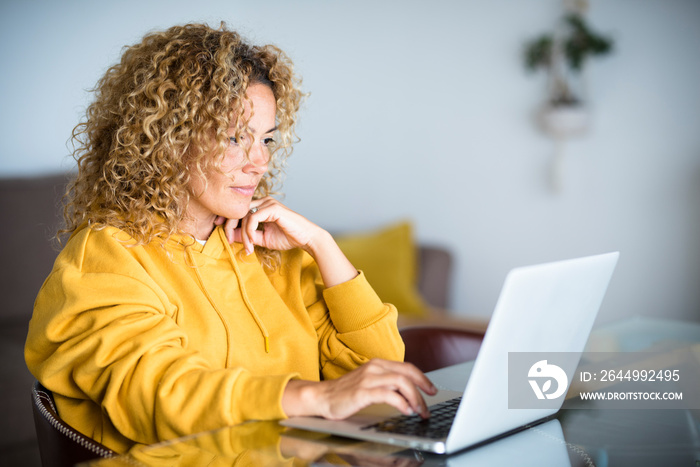 Smart work at home during coronavirus quarantine emergency concept - modern technology lifestyle of people with digital online job - woman with laptop computer