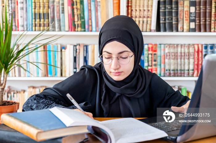 Arabic muslim woman studying online