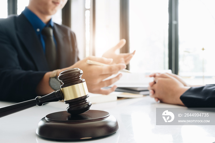 Business lawyer working about legal legislation in courtroom to help their customer, Selective Focus