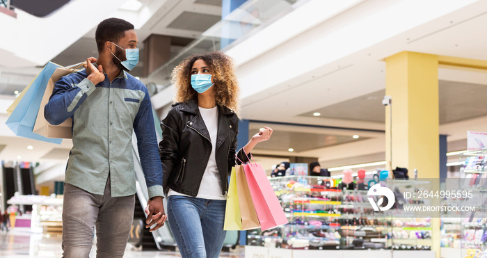 African american couple in love spending time together in mall