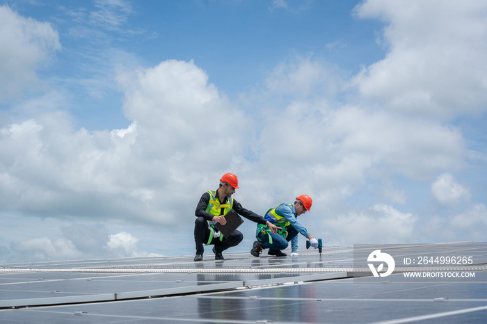 Engineers checking the operation of the system solar cell on roof at factory,Alternative energy to conserve the world’s energy,Photovoltaic module idea for clean energy production.